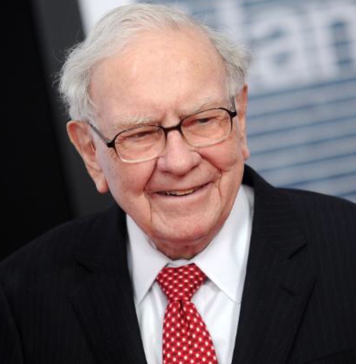 A photo of Warren Buffett whose net worth is over a billion dollars.